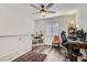 Comfortable bedroom with a ceiling fan, neutral walls, and wood-look floors at 3749 Climbing Rose St, Las Vegas, NV 89147