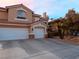 Charming two-story home with a three-car garage and desert landscaping showcasing beautiful curb appeal at 3749 Climbing Rose St, Las Vegas, NV 89147