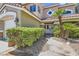Close up front entrance featuring manicured bushes, stone accents and a pathway leading to the front door at 3749 Climbing Rose St, Las Vegas, NV 89147
