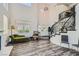 Bright living room featuring a winding staircase, high ceilings, stylish flooring, and lots of natural light at 3749 Climbing Rose St, Las Vegas, NV 89147