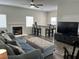 Cozy living room with a fireplace, comfortable seating, and a view of the breakfast bar at 3749 Climbing Rose St, Las Vegas, NV 89147