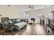 Comfortable living room featuring a fireplace, ceiling fan and hardwood floors at 3749 Climbing Rose St, Las Vegas, NV 89147