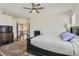 Bright primary bedroom offers a fireplace, ceiling fan and an ensuite bath at 3749 Climbing Rose St, Las Vegas, NV 89147
