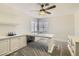 Cozy office featuring custom built-in desk, cabinets and shelves, and lots of natural light at 3749 Climbing Rose St, Las Vegas, NV 89147