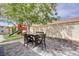 Backyard patio next to grass area, play structure, and fence at 3760 Candytuft Ridge Ave, North Las Vegas, NV 89081