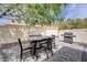 Outdoor dining area with stone patio and barbecue grill at 3760 Candytuft Ridge Ave, North Las Vegas, NV 89081