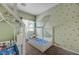 bedroom with two house beds and moon art on green walls at 3760 Candytuft Ridge Ave, North Las Vegas, NV 89081