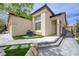 Charming home with stone accents, a covered porch, and well-manicured landscaping at 3760 Candytuft Ridge Ave, North Las Vegas, NV 89081