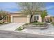 Beautiful single-story home with well-manicured lawn and a large two car garage at 3760 Candytuft Ridge Ave, North Las Vegas, NV 89081