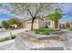 Charming single-story home with a well-maintained yard, desert landscaping, and mature trees at 3760 Candytuft Ridge Ave, North Las Vegas, NV 89081