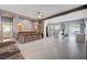 Inviting living room with tile floors and a seamless flow into the open-concept kitchen at 3760 Candytuft Ridge Ave, North Las Vegas, NV 89081