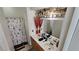 Bathroom featuring a dual sink vanity and shower with decorative curtain at 3871 Sir Bret Ct, Las Vegas, NV 89104