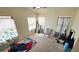 Bright bedroom featuring multiple windows and a chair at 3871 Sir Bret Ct, Las Vegas, NV 89104