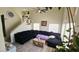 Bright living room featuring high ceilings, large windows, a ceiling fan and a large sofa at 3871 Sir Bret Ct, Las Vegas, NV 89104