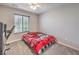 Simple bedroom featuring neutral tones, a comfortable bed, and natural light at 415 Carsin Wayne Ct, North Las Vegas, NV 89031