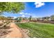 Inviting community park with lush green grass, walking path and a playground at 415 Carsin Wayne Ct, North Las Vegas, NV 89031