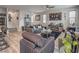 Comfortable living room featuring contemporary decor, hardwood floors, and an open layout to kitchen at 415 Carsin Wayne Ct, North Las Vegas, NV 89031