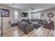 Bright and airy living room with a cozy seating area, stylish decor, and large windows at 415 Carsin Wayne Ct, North Las Vegas, NV 89031