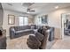 Cozy living room featuring neutral colors, plush seating, and comfortable lighting at 415 Carsin Wayne Ct, North Las Vegas, NV 89031