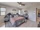Bedroom featuring dark wood furniture, tile floors, and neutral walls at 415 Carsin Wayne Ct, North Las Vegas, NV 89031