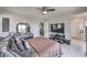 Spacious main bedroom featuring a modern dresser, ceiling fan, and ensuite bathroom at 415 Carsin Wayne Ct, North Las Vegas, NV 89031
