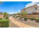 Street view of the community with landscaped walkway and well-maintained surroundings at 415 Carsin Wayne Ct, North Las Vegas, NV 89031