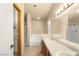 A spacious bathroom featuring dual sinks, bathtub, and a storage closet at 4197 Tolkien Ave, Las Vegas, NV 89115