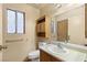 Bathroom with a vanity, mirror, and medicine cabinet above the toilet at 4197 Tolkien Ave, Las Vegas, NV 89115