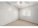 Bedroom features carpet, a ceiling fan, a window, and neutral walls at 4197 Tolkien Ave, Las Vegas, NV 89115