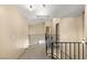 Upstairs hallway features metal railings overlooking the living area below at 4197 Tolkien Ave, Las Vegas, NV 89115