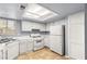 Functional kitchen features white appliances and ample counter space at 4197 Tolkien Ave, Las Vegas, NV 89115