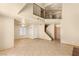 Inviting living room featuring a staircase, high ceilings, and tile flooring at 4197 Tolkien Ave, Las Vegas, NV 89115
