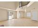 Bright and airy living room with tile floors, access to the backyard, and an open layout at 4197 Tolkien Ave, Las Vegas, NV 89115