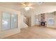 Spacious living room features tile flooring and a brick fireplace at 4197 Tolkien Ave, Las Vegas, NV 89115