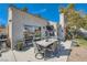 Back patio with outdoor dining set, built-in grill, and view of the spacious backyard at 4212 Herblinda Ln, North Las Vegas, NV 89032