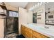 Bright bathroom features double sink vanity and updated walk-in shower at 4212 Herblinda Ln, North Las Vegas, NV 89032