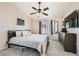 Comfortable bedroom featuring carpet, a large window, a ceiling fan, and ample closet space at 4212 Herblinda Ln, North Las Vegas, NV 89032