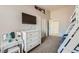 Neutral bedroom features a bunk bed, mounted television, and a white dresser at 4212 Herblinda Ln, North Las Vegas, NV 89032