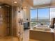 Elegant bathroom features a glass shower, soaking tub and scenic views at 4471 Dean Martin Dr # 4308, Las Vegas, NV 89103