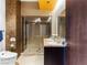 Stylish bathroom offers a glass-enclosed shower, double sink vanity, and modern fixtures at 4471 Dean Martin Dr # 4308, Las Vegas, NV 89103