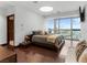 Relaxing bedroom with large window and hardwood floors at 4471 Dean Martin Dr # 4308, Las Vegas, NV 89103
