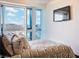 Cozy bedroom showcases large windows with city views and a sleek mounted TV at 4471 Dean Martin Dr # 4308, Las Vegas, NV 89103