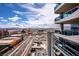 Stunning city view from a high-rise balcony, featuring sleek architecture and a bustling highway below at 4471 Dean Martin Dr # 4308, Las Vegas, NV 89103