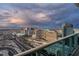 Stunning city view from a balcony featuring hotels and highways under a colorful and dramatic sky at 4471 Dean Martin Dr # 4308, Las Vegas, NV 89103