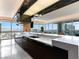 Modern kitchen features sleek countertops, dark cabinetry, and expansive windows with a stunning city view at 4471 Dean Martin Dr # 4308, Las Vegas, NV 89103