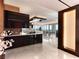 Bright, modern kitchen with dark cabinets, light countertops and tiled floors at 4471 Dean Martin Dr # 4308, Las Vegas, NV 89103