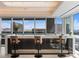 Modern bar area with sleek black and white counter, seating for three, and floor-to-ceiling city views at 4471 Dean Martin Dr # 4308, Las Vegas, NV 89103