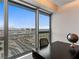 Bright office space with large windows framing a city view, paired with a modern desk and decor at 4471 Dean Martin Dr # 4308, Las Vegas, NV 89103