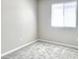 Bedroom with window and neutral color scheme at 5060 Serene Skies St, Las Vegas, NV 89130