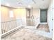 Bright loft area with railing and modern lighting at 5060 Serene Skies St, Las Vegas, NV 89130